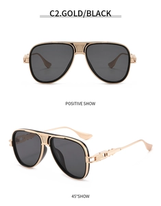 Detailaufnahme der Gold-Schwarz-Aviator-Metallfassung mit strukturierter Brücke