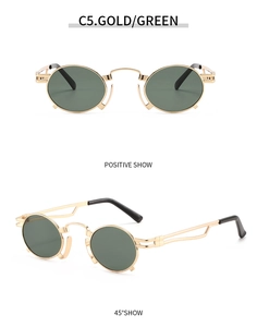 Detail of vintage steampunk round sunglasses with gold metal frame and green lenses