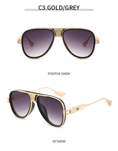 Details einer goldenen Fliegerbrille mit grauen Verlaufsgläsern und feiner Gravur