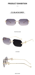 Detail of rimless gradient sunglasses with golden snake-embossed metal temples and grey lenses