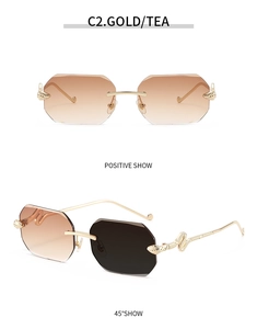 Detail view of gold snake-shaped temples and gradient tea lenses on rimless sunglasses