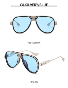 Details einer silbernen Pilotenbrille mit blauen Gläsern und strukturierten Bügeln