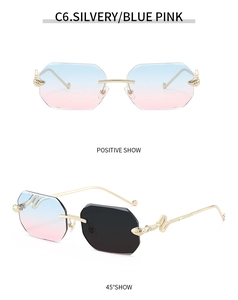 Detail view of rimless octagon sunglasses with blue pink gradient lenses and gold snake temples
