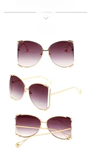 Détails des lunettes de soleil dorées oversize avec verres dégradés et perles élégantes