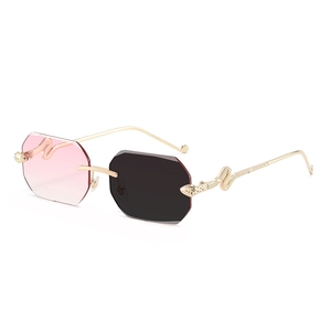 Frameless octagonal sunglasses with gold snake temples and pink-grey gradient lenses
