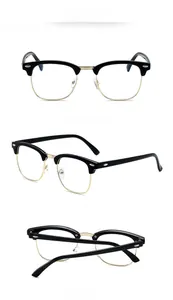 Three-angle view of vintage semi-rimless glasses frame in polished black and gold