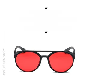 Detailed view of punk round sunglasses with matte black frame and red lenses side shields