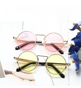 Detail of retro round metal sunglasses with spring hinge and candy color lenses
