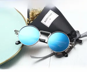Detail of blue mirrored lenses and silver steampunk metal frame with spring hinge