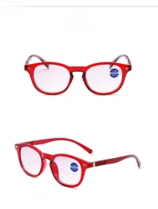 Detail view of red bifocal reading glasses with anti-blue light +1.00 lenses and wave arms