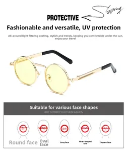 Detail of retro round punk sunglasses with gold metal frame and yellow tinted lenses