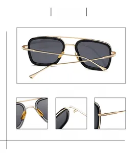 Detail view of polarized pilot sunglasses featuring gold double bridge and metal hinges