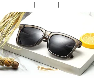 Detailed view of square frame polarized sunglasses with translucent tea gray finish