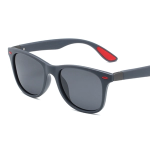 Classic matte grey polarized sports sunglasses with red rubber temple pads on white background