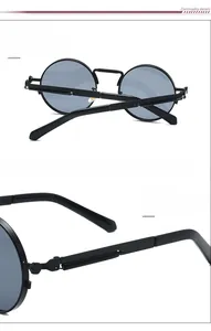 Detail view of steampunk round sunglasses showing vintage black metal frame and spring hinges