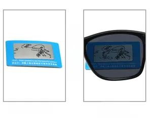 Polarized lens test card showing hidden pattern through a black frame sunglass lens
