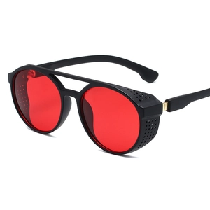Retro steampunk round sunglasses with black frames and vibrant red lenses in 45-degree view