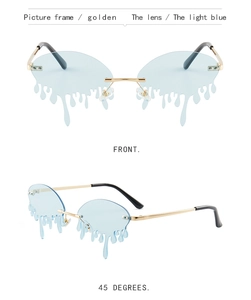 Macro view of trendy gold frameless sunglasses with unique light blue drip shape lenses