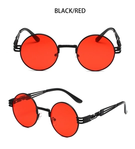 Macro shot of steampunk metal frame details and spring hinge on black and red sunglasses