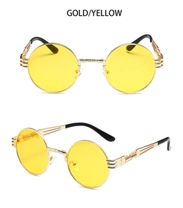 Steampunk sunglasses detail featuring retro golden metal frame and yellow round lenses