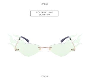 Detail view of flame-shaped rimless sunglasses with gold temples and yellow tinted lenses