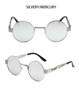 Detail of retro steampunk sunglasses with silver metal frame and engraved spring legs