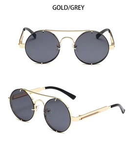 Detail view of retro round sunglasses featuring gold metal frame and spring hinges