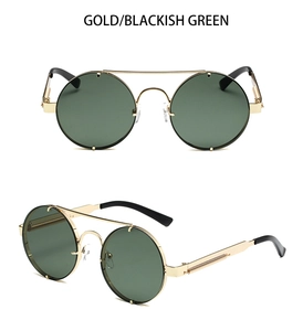 Detailed view of punk style round gold metal sunglasses with dark green lenses