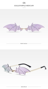 Close-up of rimless bat-shaped sunglasses with gold metal frame and purple mercury lenses
