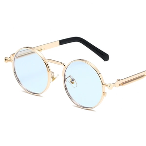 Retro round steampunk sunglasses with gold metal frame and light blue lenses for unisex