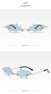 Macro detail of rimless bat-shaped sunglasses with blue lenses and gold metal temples