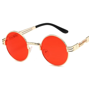 Retro steampunk round sunglasses with red lenses and ornate gold spring metal frames
