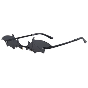 Gothic bat wing sunglasses with black frameless lenses and detailed bone structure lines