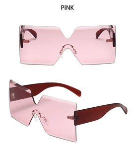 Detailed view of oversized rimless sunglasses featuring pink lenses and CE mark detail