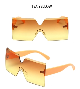 Detailed macro view of tea yellow gradient frameless lenses and durable metal hinges