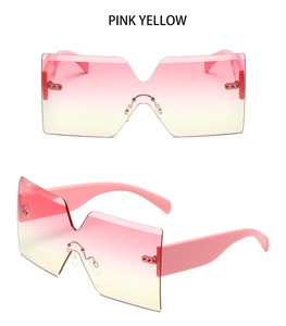 Detail of pink yellow gradient oversized rimless sunglasses with wide pink temple arms