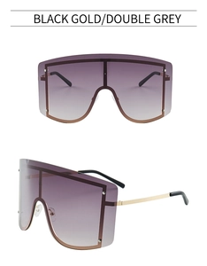 Detailansicht der Oversize-Schild-Sonnenbrille mit schwarz-goldenen Bügeln und grauen Gläsern
