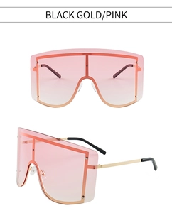 Detailansicht der Oversize-Schild-Sonnenbrille mit gold-schwarzem Rahmen und rosa Verlauf