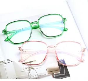 Detailed view of oversized geometric TR90 frames in transparent green and pink