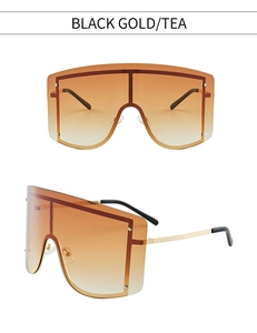 Detailansicht der übergroßen Shield-Sonnenbrille mit Verlaufsgläsern in Tee und Goldrahmen