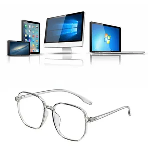 Close-up of transparent TR90 oversized blue light blocking glasses with digital devices