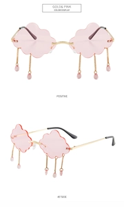 Frameless cloud-shaped sunglasses with pink lenses and golden raindrop chain tassels