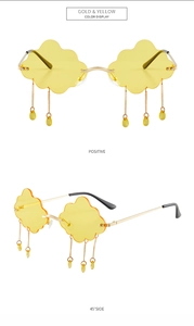 Cloud-shaped rimless sunglasses with gold frames and yellow tassel droplet pendants