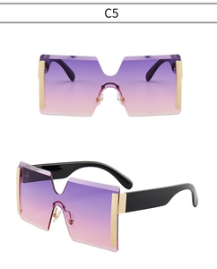 Détail de lunettes de soleil sans monture surdimensionnées avec verres dégradés violets