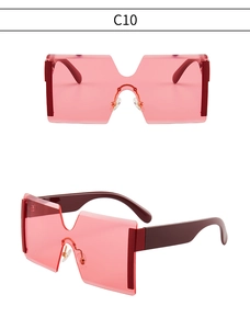 Détail de lunettes de soleil sans monture surdimensionnées avec verres roses et code C10