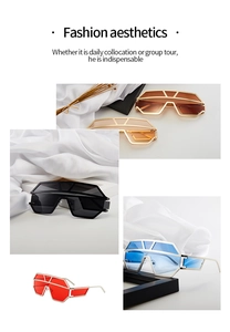 Close-up of futuristic geometric oversized sunglasses in brown, black, blue, and red colors