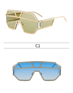 Detailed look at oversized geometric metal frame sunglasses with yellow and blue gradient lenses