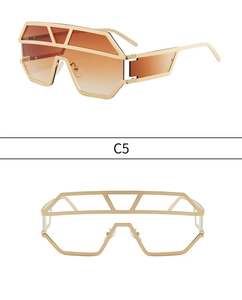 Detailed top view of golden geometric oversized shield sunglasses with orange lenses