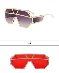 Detail of oversized geometric shield sunglasses with gradient purple and red lenses