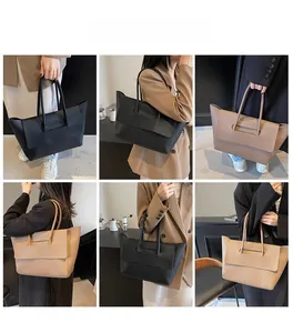 Vues détaillées du grand sac cabas montrant les poignées et la texture du cuir grainé